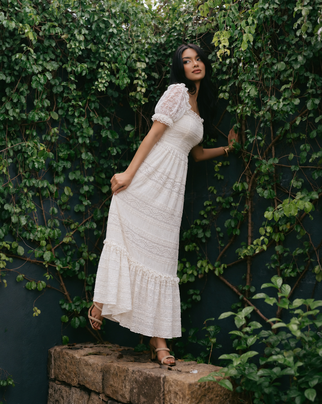 Pearl White Romantic Lace Gown side view in garden