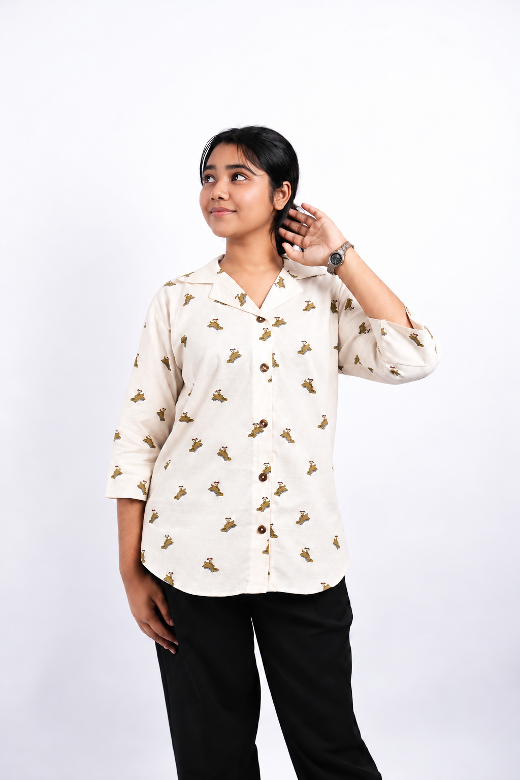 Dino Daze dinosaur-print shirt in a three-quarter studio view, showing its open Cuban collar, three-quarter sleeves and curved hem.